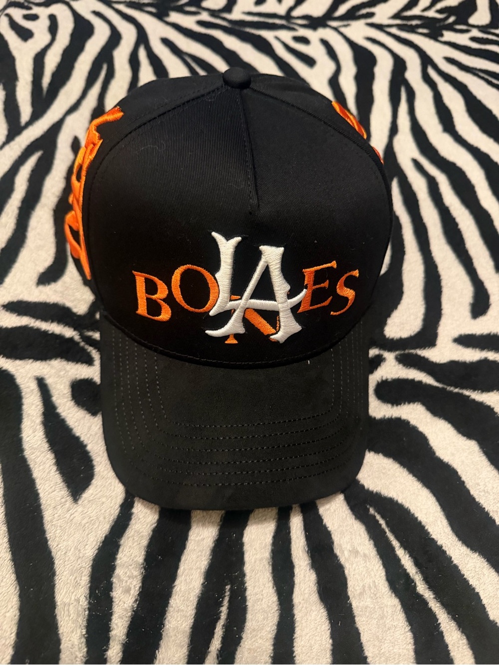 Estrella Hats "LA Bones" cap featuring bold orange and white embroidery